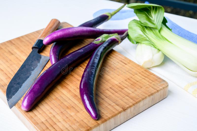 japanese-eggplant-wooden-board-cooking-knife-pak-choi-salad-japanese-eggplant-wooden-board-knife-pak-choi-111285983.jpg