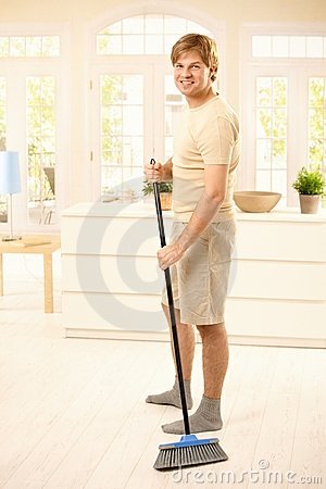 guy-sweeping-floor-16418746.jpg